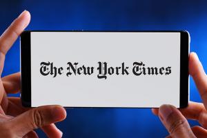 The New York Times logo on cellphone screen