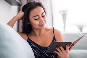 Woman reading on a tablet