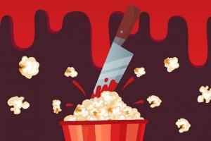 Knife stabbing into a bucket of popcorn
