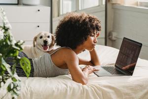 Woman watching a laptop computer screen