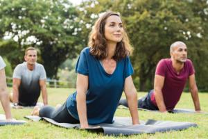 a group of people stretching on their yoga mats