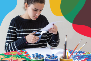Teen making a paper craft