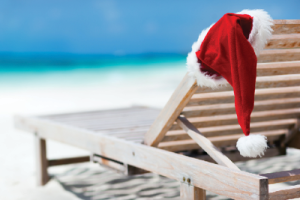 Santa hat over a chair on the beach