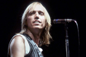 Tom Petty in front of a microphone