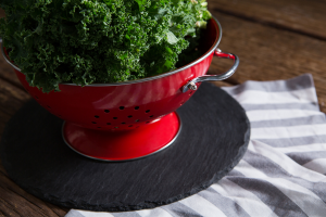 mustard greens in a colander