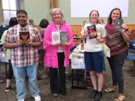 Waldo branch's winning team, posed holding their books.