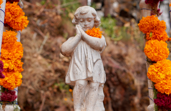 Photo of Child's Headstone with Marigolds