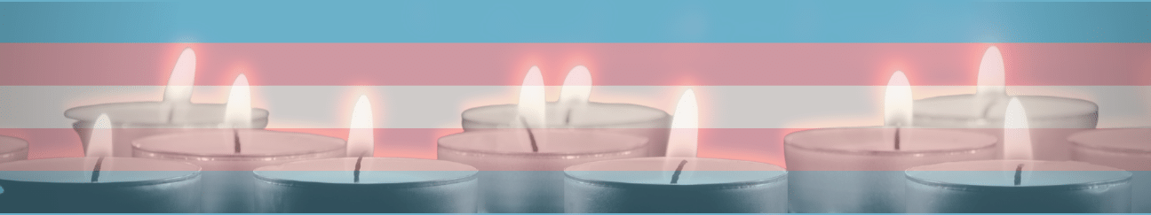 A series of lit candles, in black and white, are imposed upon the transgender flag (striped: blue, pink, white, pink, blue).