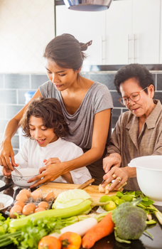 Photograph of family cooking together