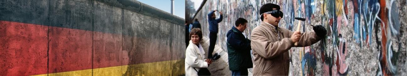 Berlin Wall with Germany's flag of a black, red and yellow stripe. A graffitied Berlin Wall, with people hammering it.