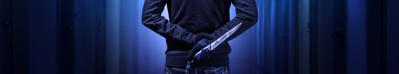 Image of Person Holding Knife Behind Their Back