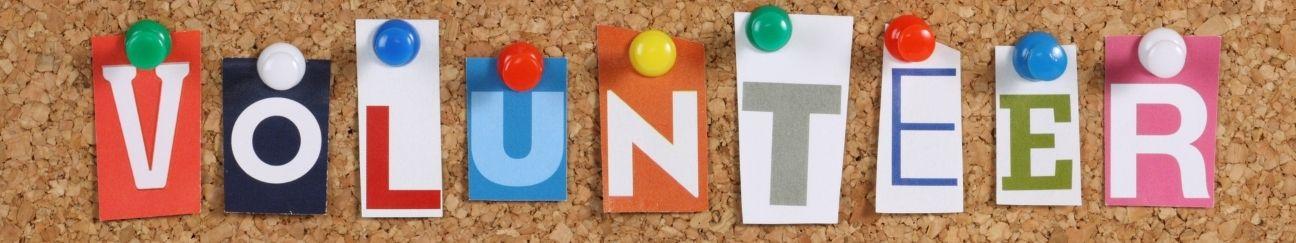 Letters spelling Volunteer pinned to a board