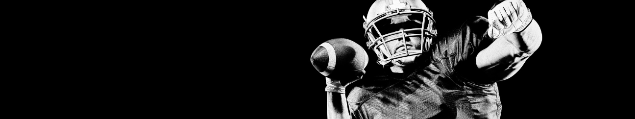 A long thin banner with a black background. In the foreground is a black and white image of a football player preparing to through a football.