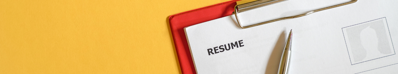 A long thin banner with an orange-yellow background. On the right is a red clipboard with a paper that says "resume" at the top.