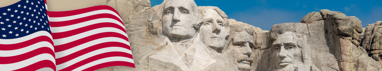 American flag next to Mount Rushmore