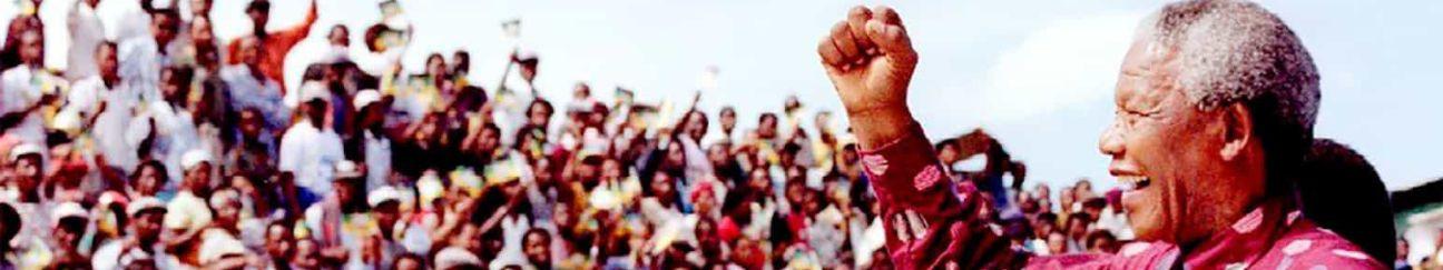 Nelson Mandela with cheering crowd