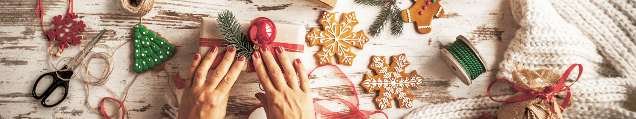 hands over an assortment of holiday craft items