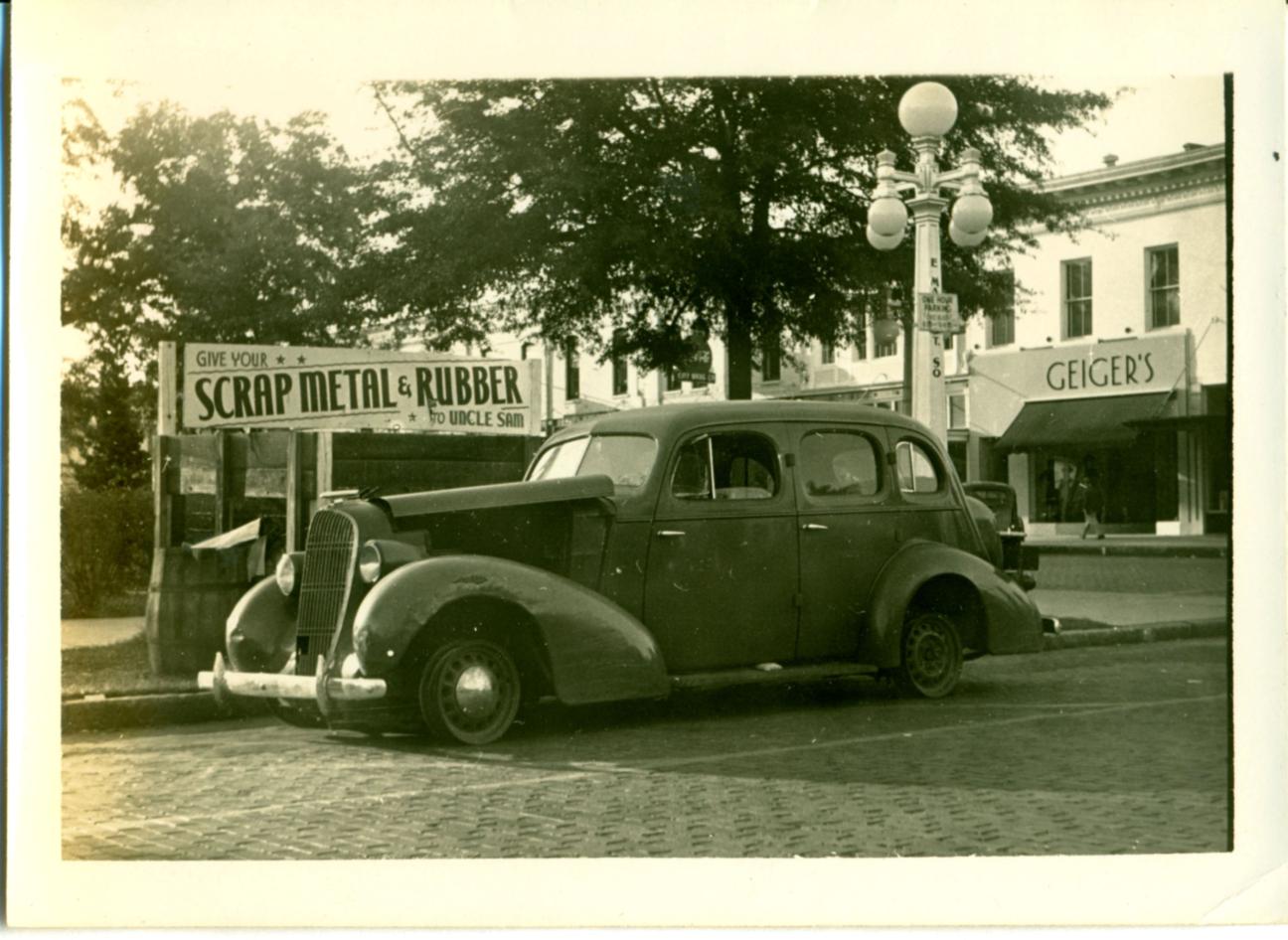 car with no tires advertising need for scrap metal for WWII