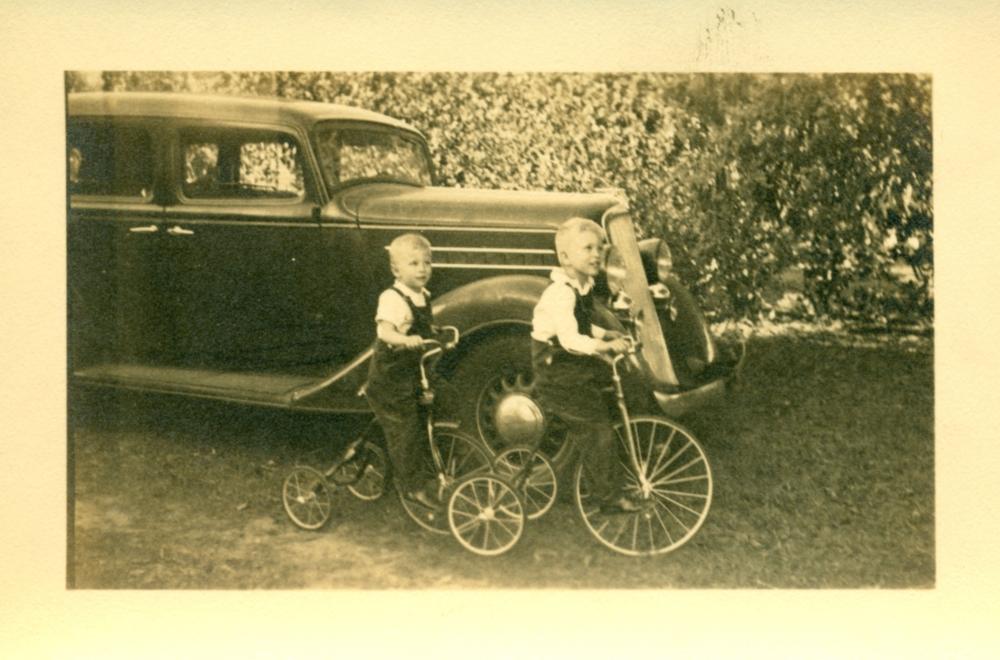Godwin boys on tricycles