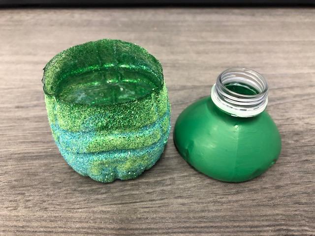 An image of decorated plastic water bottle pieces