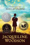 young African American girl with a blue sky above her head