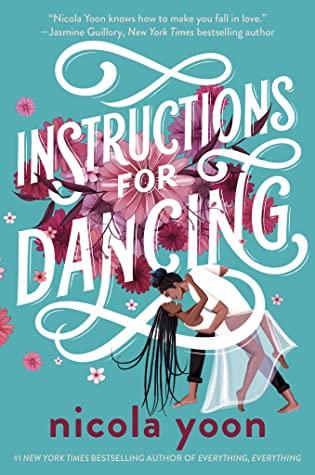 A man with his hair in a bun is dancing with a woman with long braids on a blue background with pink flowers