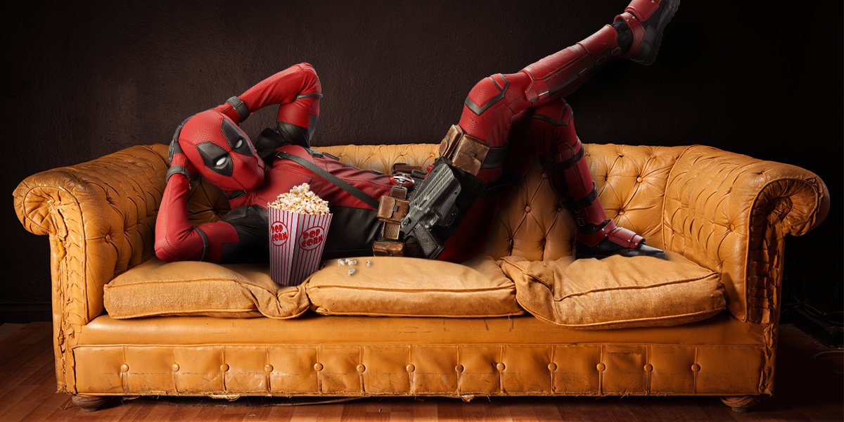 Deadpool lounging on couch