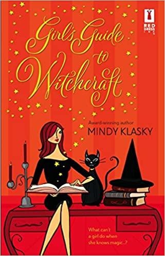 The cover of "Girl's Guide to Witchcraft" by Mindy Klasky, which has a cartoonish drawing of a woman in a black dress sitting on a desk next to a witch's hat on a pile of books and a black cat. She is holding an open book.