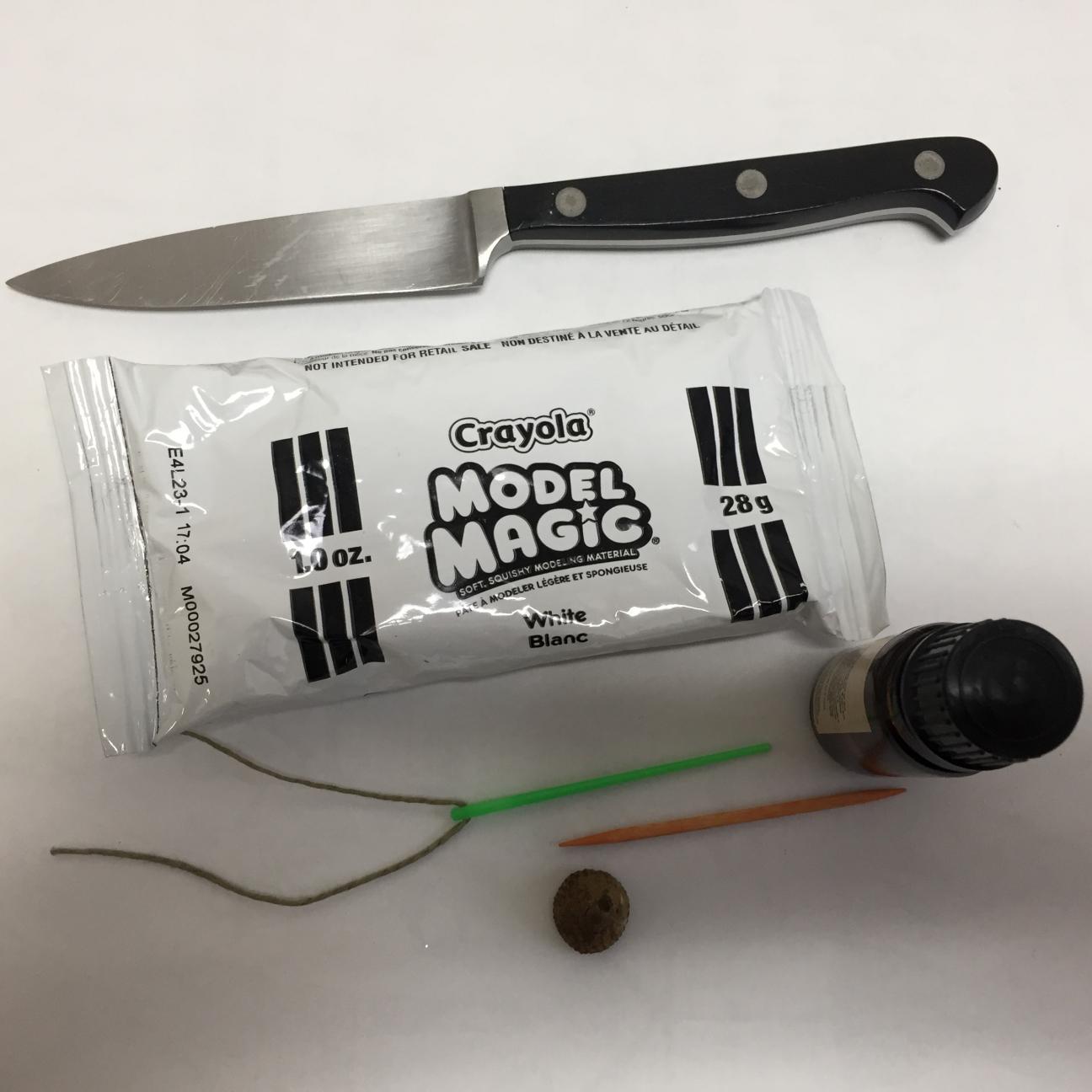 Supplies for DIY aromatherapy diffuser: clay, knife, cord, essential oil, needle, toothpick Supplies for DIY aromatherapy diffuser: clay, knife, cord, essential oil, needle, toothpick