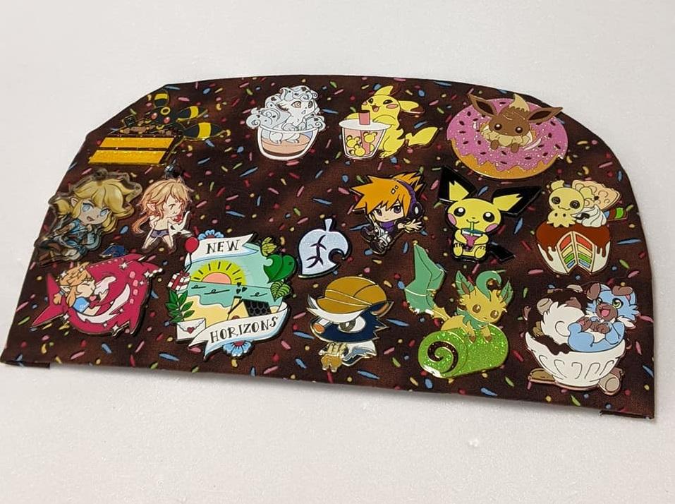 picture of an ita bag board with nintendo game pins and buttons on it