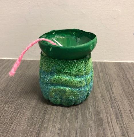 The image of an empty planter created out of a plastic water bottle