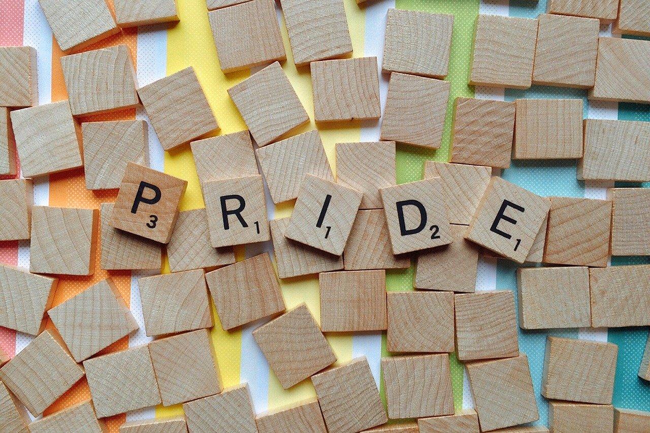 Scrabble pieces spelling out PRIDE