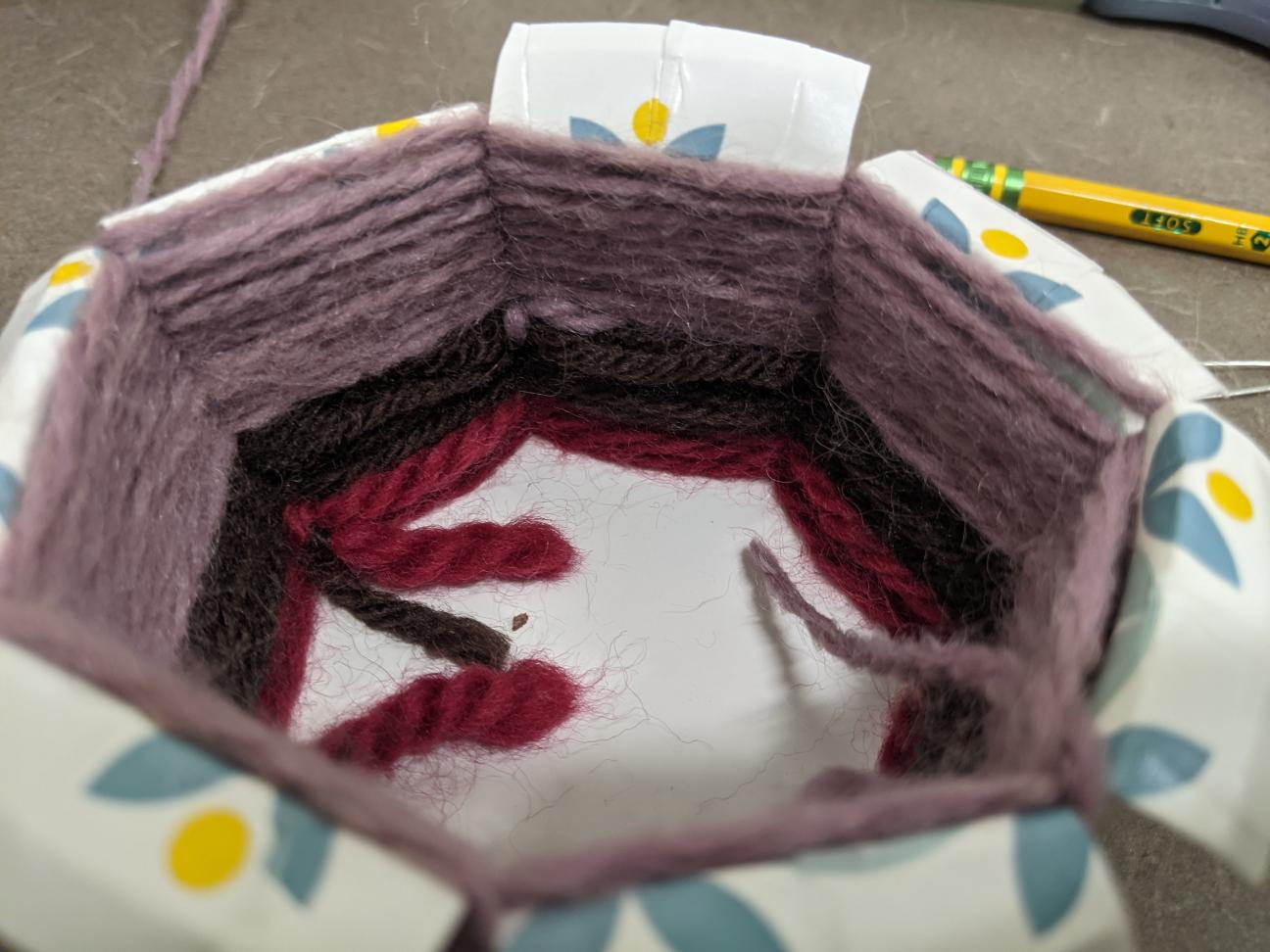 Hiding your yarn ends The inside of a woven yarn basket, with all the ends showing