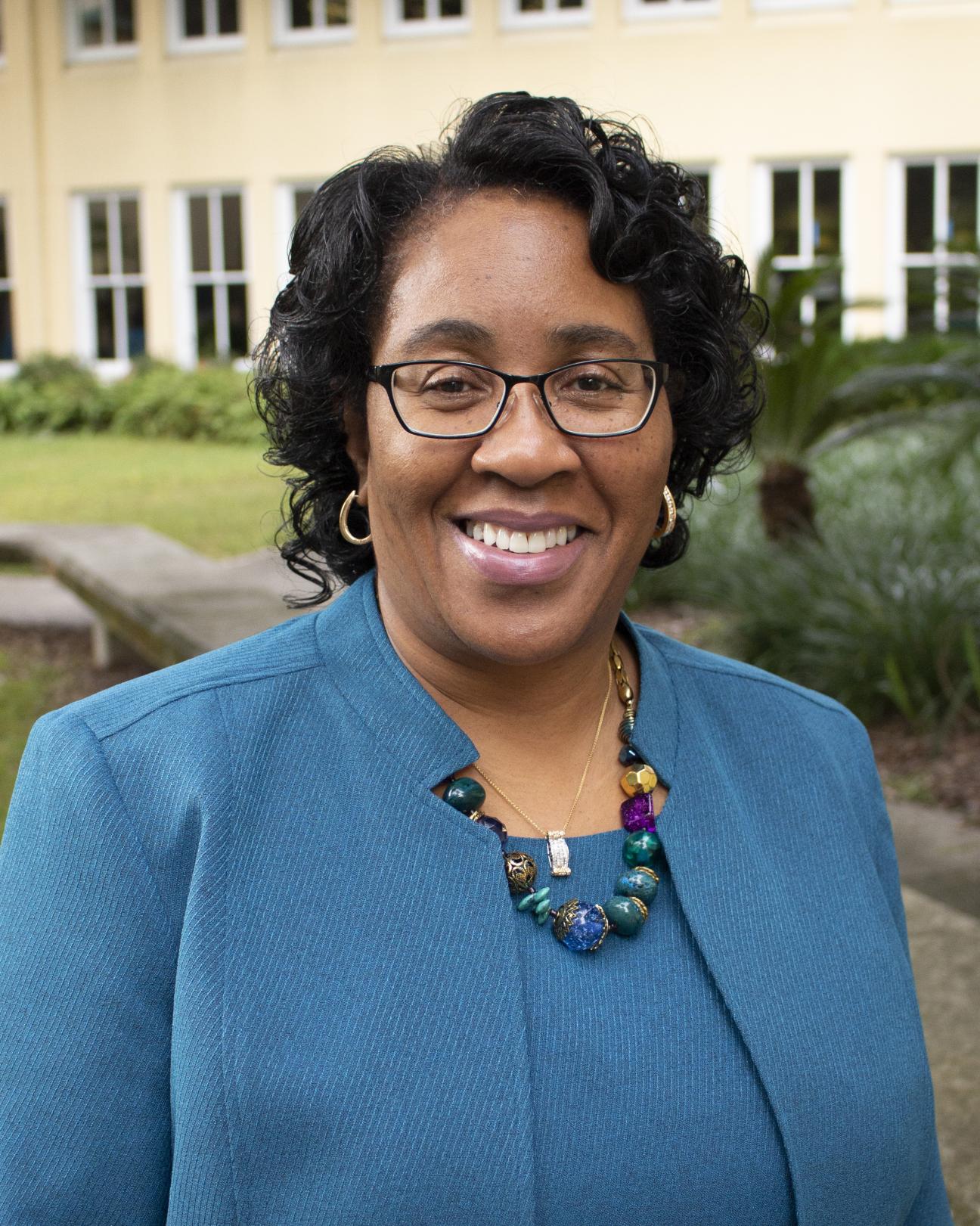 Woman in a business suit smiling