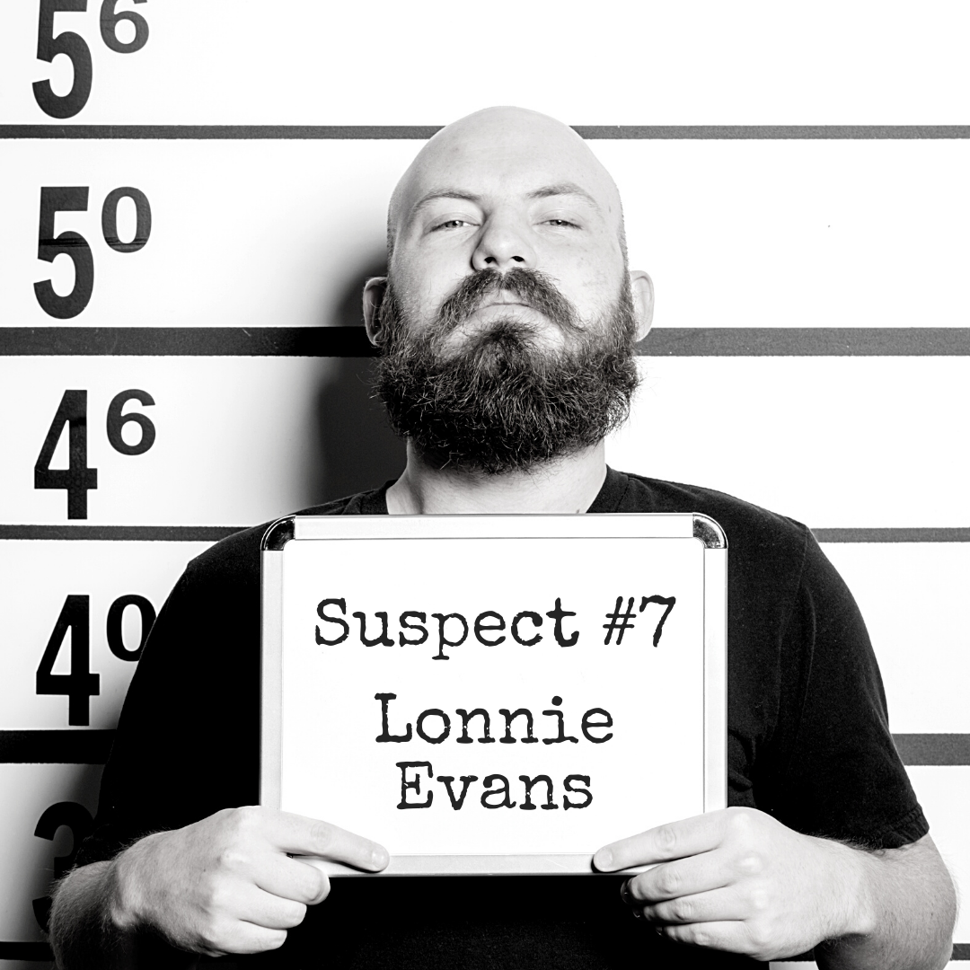 Suspect #7: Lonnie Evans Black and white mugshot of a man with a beard holding up a board that says "Suspect #7: Lonnie Evans"