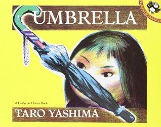 The cover of "Umbrella" by Tarō Yashima which has a yellow background and drawing of a small Japanese girl's face staring intently at a closed blue umbrella. The title and author are in white on brown rectangle backgrounds at the top and bottom. 