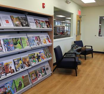 Shelf of magazines and chairs at the High Springs Branch