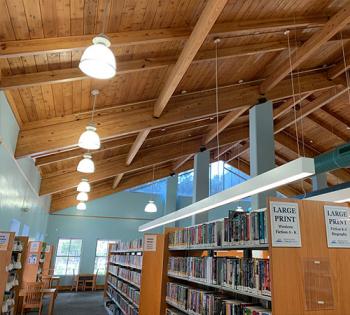 Wooden ceiling beams above book shelves at the Millhopper Branch