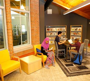 People reading in the Tower Road Branch quiet reading room