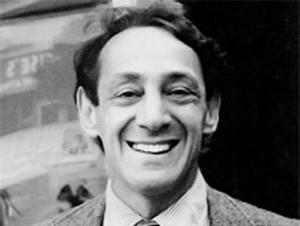 Close-up profile picture of Harvey Milk smiling for the camera