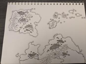 A photo of a fantasy style map, drawn on sketchpad paper with charcoal and graphite pencil. There are two large landmasses and an archipelago of islands.