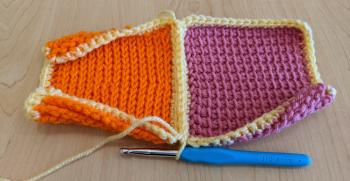 The orange and pink swatches, fully joined together now with slip stitches down one edge.