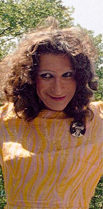 Sylvia Rivera, wearing a bright yellow dress, leads an ACT-UP march in New York City on June 26, 1994.