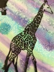 A brown tall giraffe steps in front of a sparkly, light colored background 