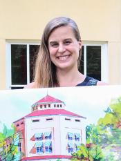 Author Lauren Groff holding an oversized library card