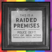 A framed historic sign stating "This is a RAIDED PREMISES - Police Dept City of New York".