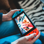 Nintendo switch being played in lap