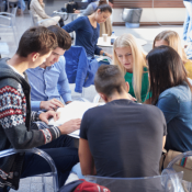 teens in chair circle discussing writing