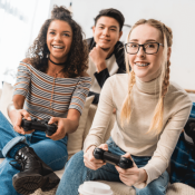 teens playing video games together