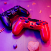 video game controllers on neon light reflected background